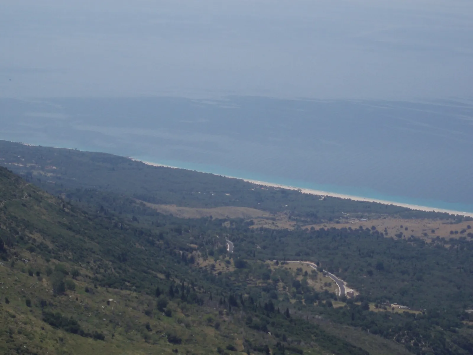 View from the hills over a long beach and blue sea on the Albanian Riviera near Himara