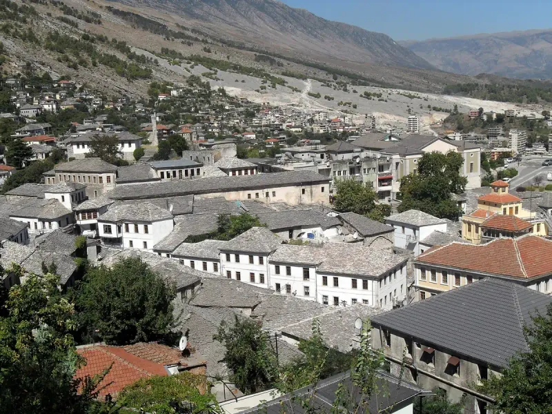 Stone roofs of an old town on a slope