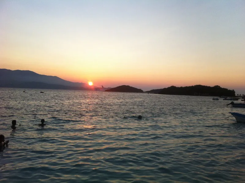 Sunset over the sea between islands
