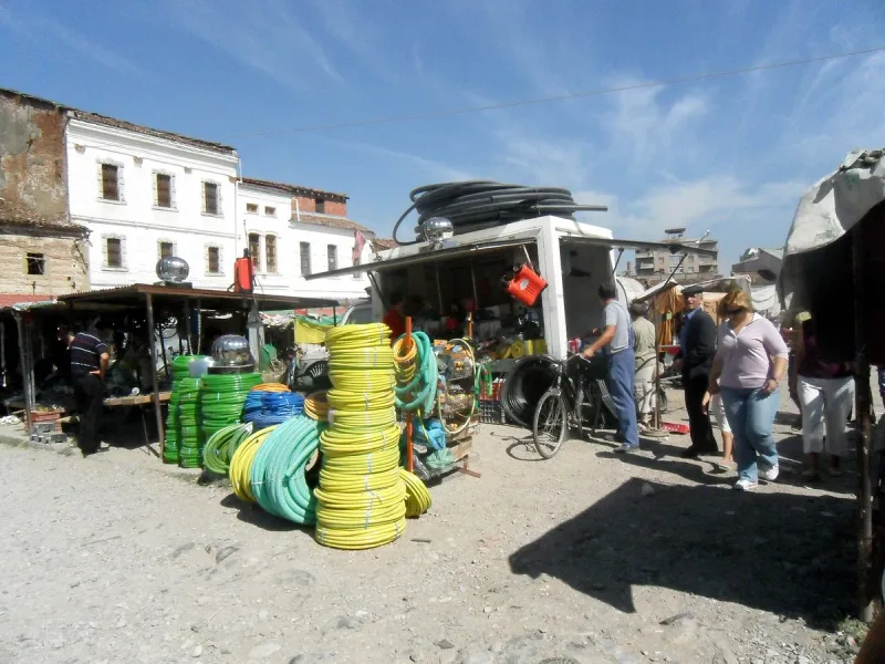 Market stalls with colourful goods and shoppers